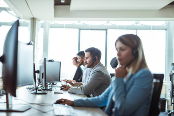 Colleagues working in a call centre.