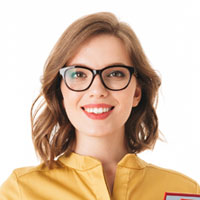 smiling-lady-in-eyeglasses-and-dress-standing-with-SBAK95C