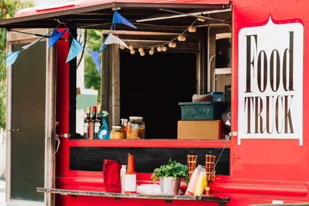 Buenos Aires, Argentina - March 11, 2017: Window selling of a red food truck with pennants