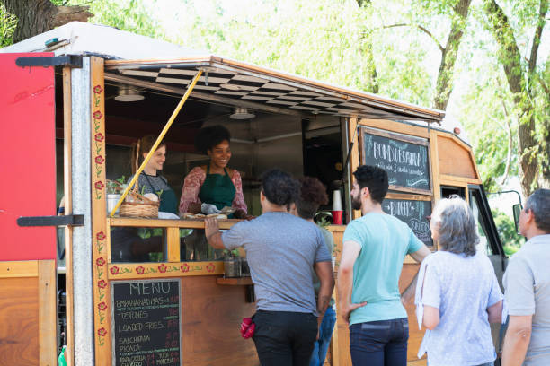 people working in a food truck