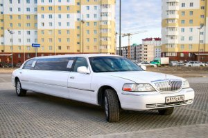 Novyy Urengoy, Russia - May 23, 2016: White stretch car Lincoln Town Car in the city street.