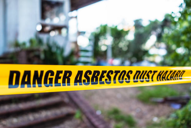 Cordon tape warning people to stay away from an asbestos removal site.