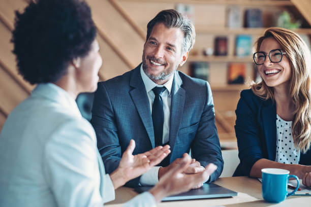 Business persons talking in the office