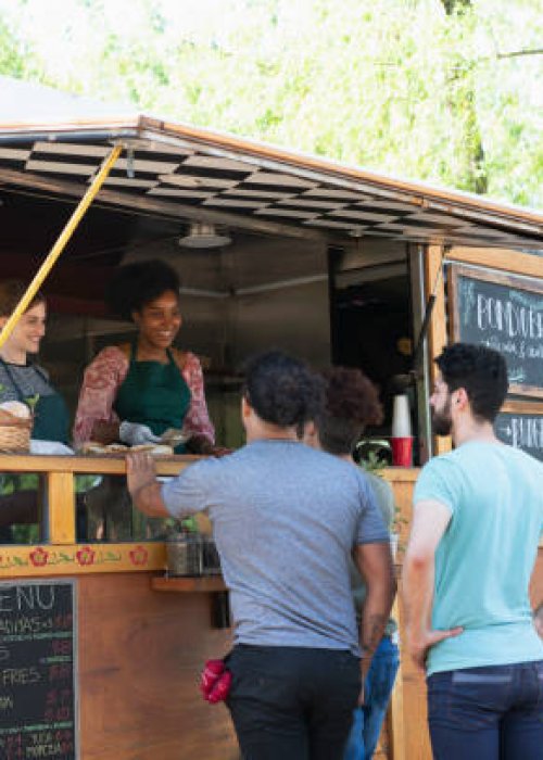 people working in a food truck