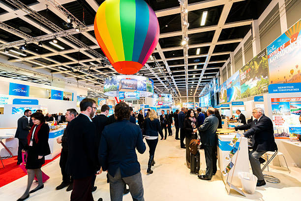 Berlin, Germany - March 10, 2016: Various exhibitor booths seen during the ITB Berlin 2016, one of Germany's biggest travel fairs held in Messe Berlin in Berlin, Germany. Visitors can be seen walking around the aisles.